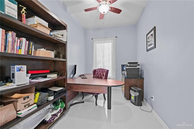 office area with tile patterned floors and ceiling fan