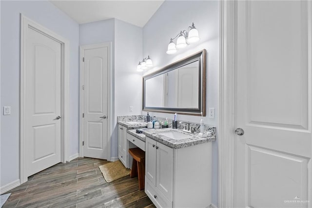 bathroom featuring vanity and hardwood / wood-style flooring