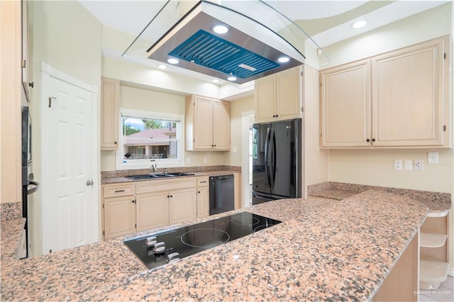 kitchen featuring kitchen peninsula, ventilation hood, light stone countertops, black appliances, and sink