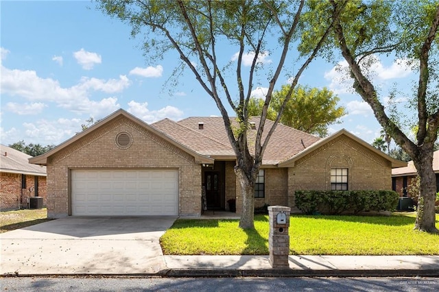 ranch-style home featuring a garage and a front yard