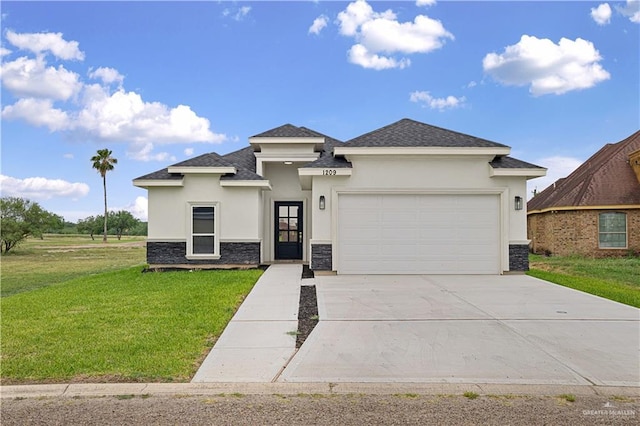 1209 Rhett Dr, Pharr, TX 78577 - prairie-style home with stone siding, stucco siding, a front lawn, an attached garage, and concrete driveway