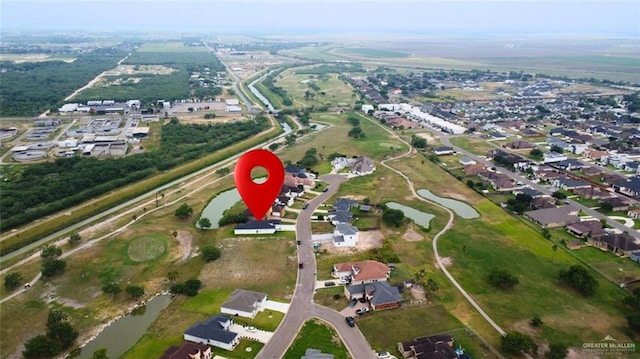 1209 Rhett Dr, Pharr, TX 78577 - aerial view of property and surrounding area featuring a large body of water and nearby suburban area
