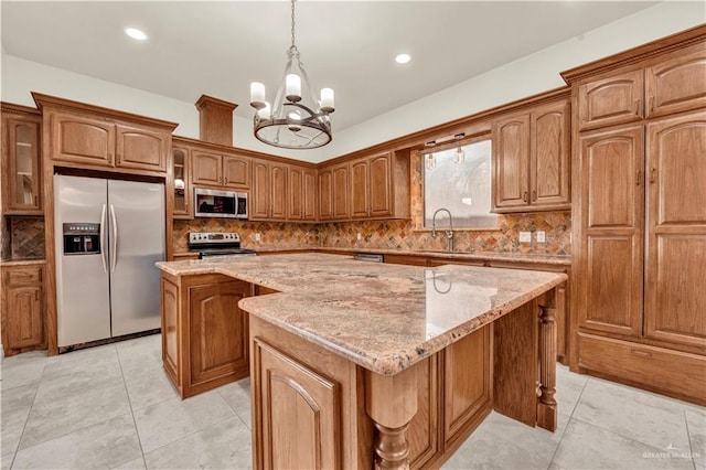 kitchen with brown cabinetry, a kitchen island, glass insert cabinets, and stainless steel appliances