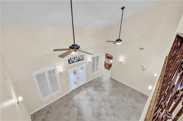 details featuring a ceiling fan, french doors, visible vents, and baseboards