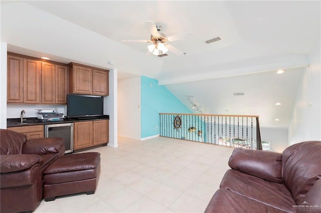 310 E Houston St Unit 1403, Port Isabel, TX 78578 - living area with beverage cooler, a ceiling fan, baseboards, recessed lighting, and vaulted ceiling