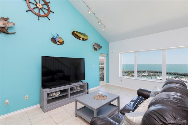 310 E Houston St Unit 1403, Port Isabel, TX 78578 - tiled living room featuring track lighting, baseboards, and high vaulted ceiling