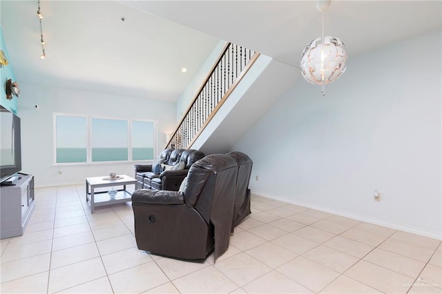 310 E Houston St Unit 1403, Port Isabel, TX 78578 - living area with light tile patterned floors, baseboards, and stairs