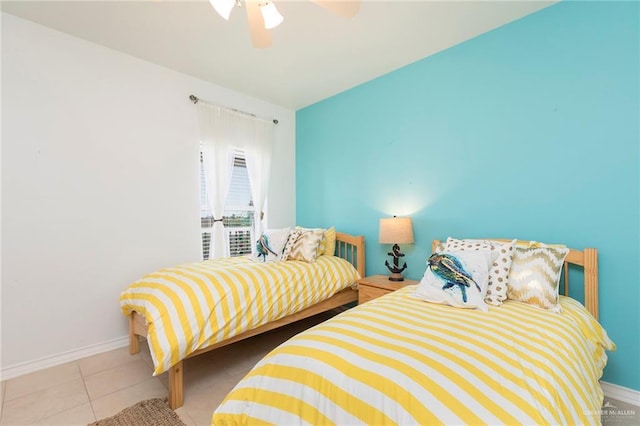 310 E Houston St Unit 1403, Port Isabel, TX 78578 - bedroom featuring baseboards, tile patterned flooring, and a ceiling fan
