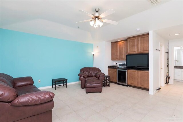 310 E Houston St Unit 1403, Port Isabel, TX 78578 - living area featuring beverage cooler, a ceiling fan, and baseboards
