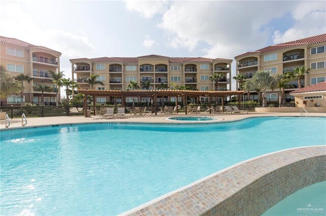 310 E Houston St Unit 1403, Port Isabel, TX 78578 - community pool featuring fence, a patio area, and a hot tub