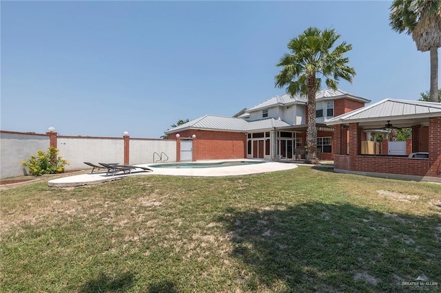 3305 W San Luis Cir, Mission, TX 78573 - view of grassy yard featuring ceiling fan and a patio