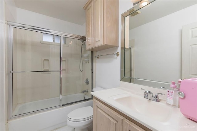 3305 W San Luis Cir, Mission, TX 78573 - bathroom with toilet, vanity, and enclosed tub / shower combo