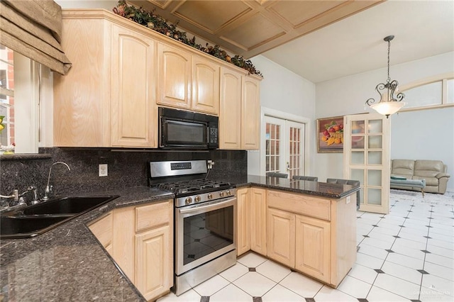 3305 W San Luis Cir, Mission, TX 78573 - kitchen featuring stainless steel gas range, black microwave, a sink, light brown cabinets, and french doors