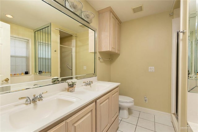 3305 W San Luis Cir, Mission, TX 78573 - bathroom with a shower stall, tile patterned flooring, baseboards, toilet, and double vanity