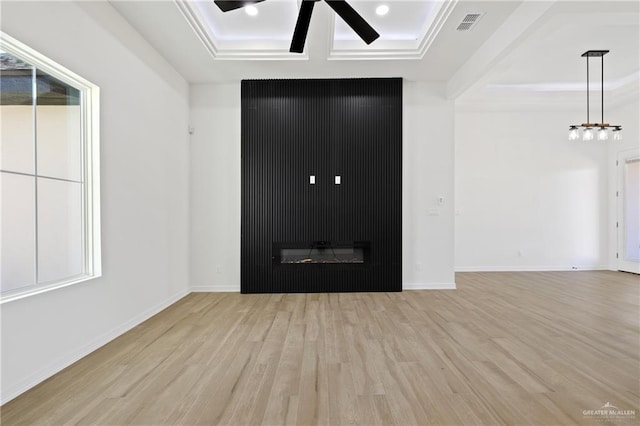 entryway with light hardwood / wood-style flooring, ceiling fan, a raised ceiling, a fireplace, and beamed ceiling