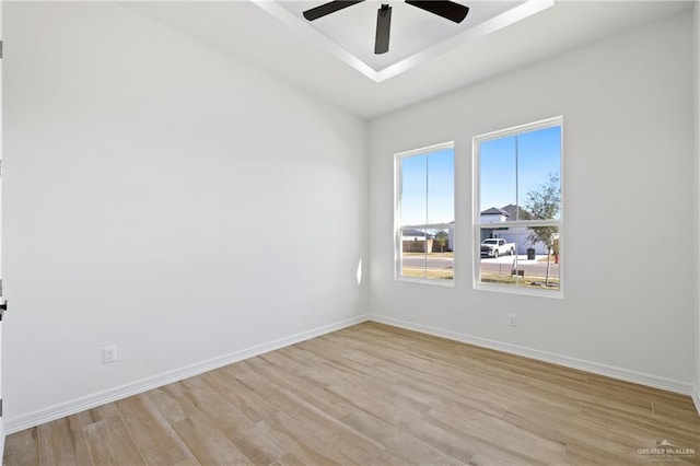 empty room featuring ceiling fan and light wood-type flooring