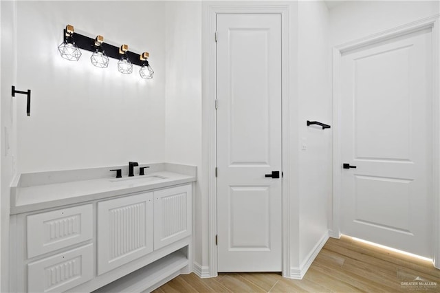 bathroom with vanity and hardwood / wood-style floors