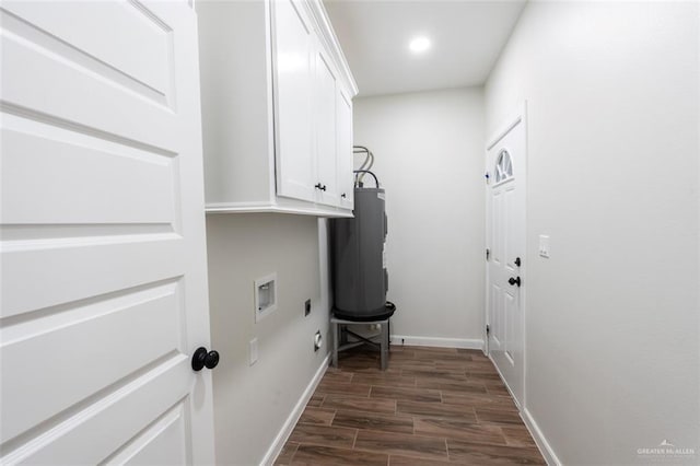 laundry area with electric dryer hookup, cabinets, hookup for a washing machine, and water heater