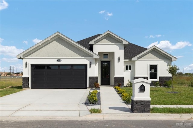 view of front of house featuring a garage and a front yard