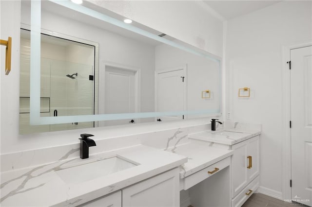 bathroom with an enclosed shower and vanity