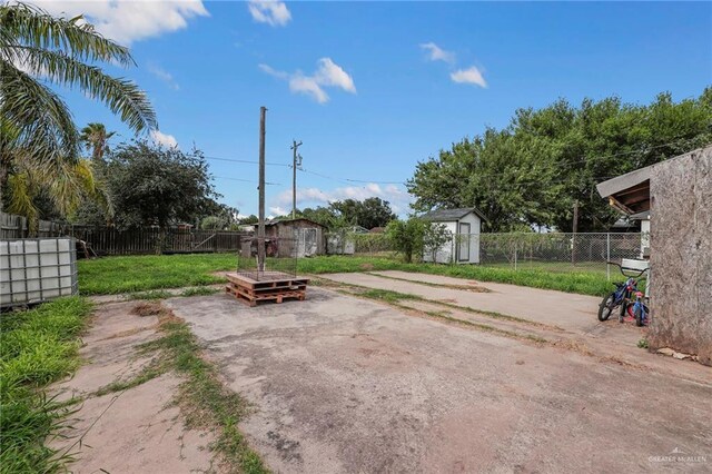 524 E Fannin Ave, Alamo, TX 78516 - fenced backyard with a storage shed