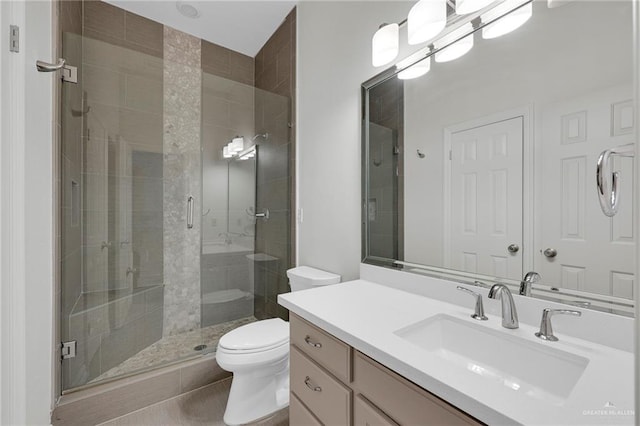 1900 E 2 Mile Line Rd, Mission, TX 78574 - full bathroom featuring vanity, tile patterned floors, toilet, and a shower stall