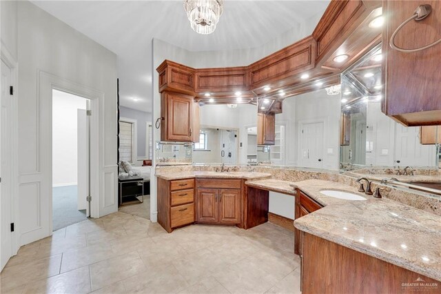 1900 E 2 Mile Line Rd, Mission, TX 78574 - full bath with vanity and an inviting chandelier