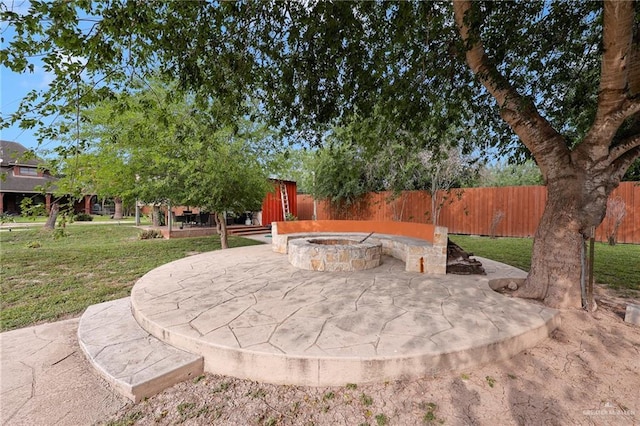 1900 E 2 Mile Line Rd, Mission, TX 78574 - view of community featuring an outdoor fire pit, a patio area, a yard, and fence