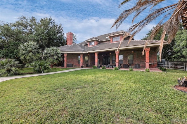 1900 E 2 Mile Line Rd, Mission, TX 78574 - view of front of home featuring fence, a chimney, and a front yard