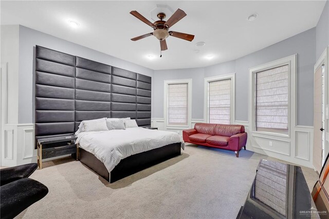 1900 E 2 Mile Line Rd, Mission, TX 78574 - carpeted bedroom featuring a wainscoted wall, ceiling fan, a decorative wall, and recessed lighting