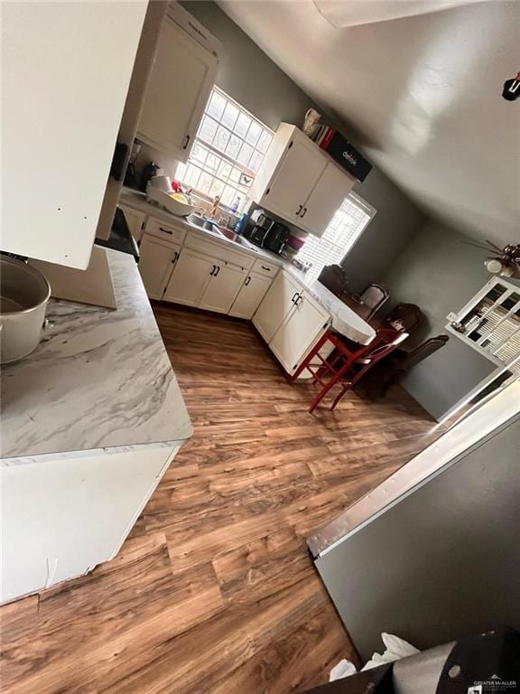 kitchen featuring light countertops and wood finished floors