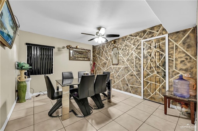 dining room featuring tile patterned flooring, ceiling fan, and tile walls