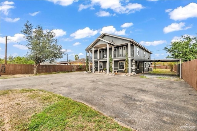 exterior space with a carport