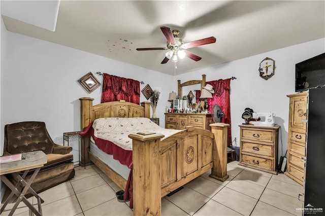 tiled bedroom featuring ceiling fan