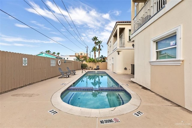 102 E Gardenia St, South Padre Island, TX 78597 - view of pool featuring a patio area, a pool with connected hot tub, and a fenced backyard