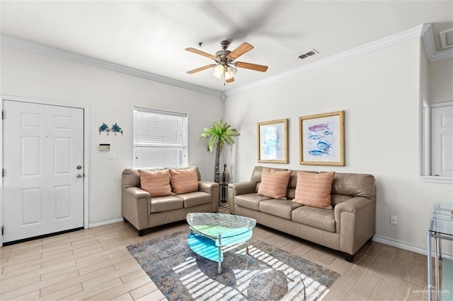 102 E Gardenia St, South Padre Island, TX 78597 - living room with visible vents, ornamental molding, light wood-type flooring, baseboards, and ceiling fan