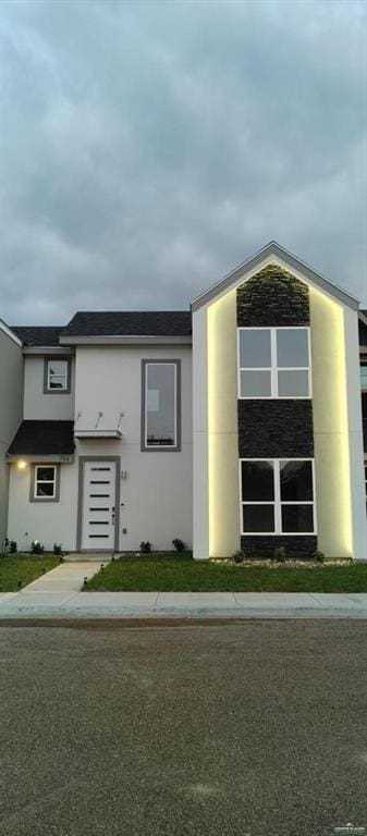 view of front of house featuring stucco siding