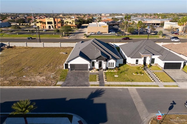 birds eye view of property with a residential view