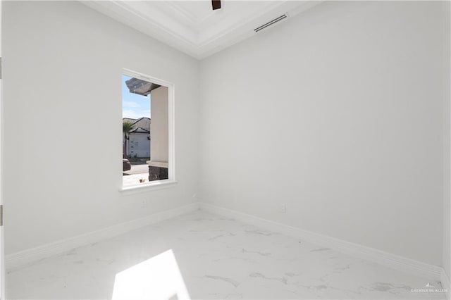 empty room with visible vents, marble finish floor, and baseboards