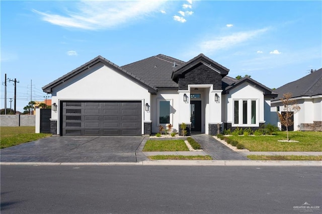 ranch-style home with stone siding, stucco siding, and a garage