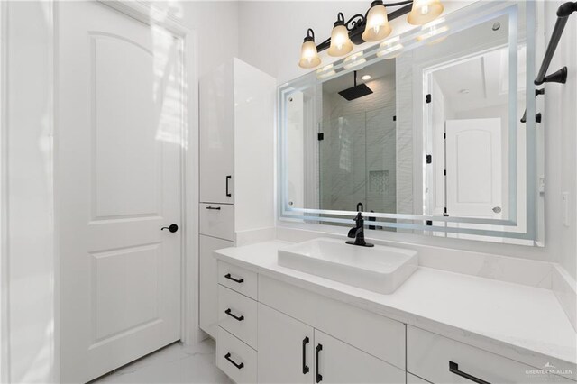 full bath featuring marble finish floor, vanity, and a stall shower