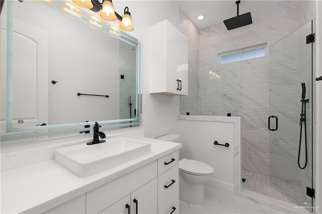full bath with a shower stall, vanity, marble finish floor, toilet, and recessed lighting