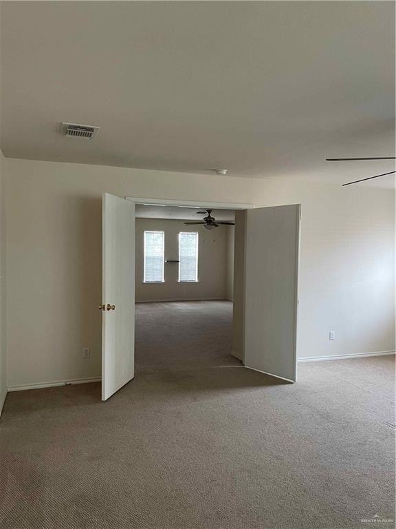 unfurnished room with carpet flooring