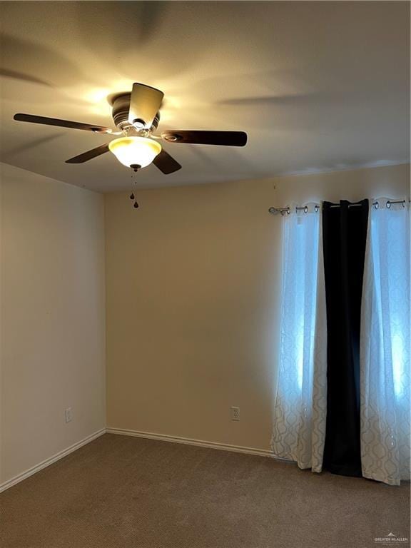 unfurnished room featuring carpet flooring and ceiling fan