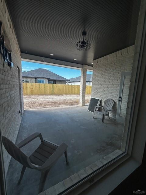 view of patio featuring ceiling fan