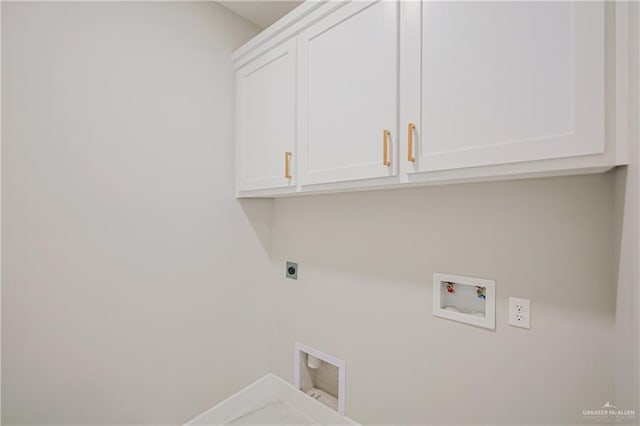 clothes washing area with washer hookup, cabinet space, and hookup for an electric dryer