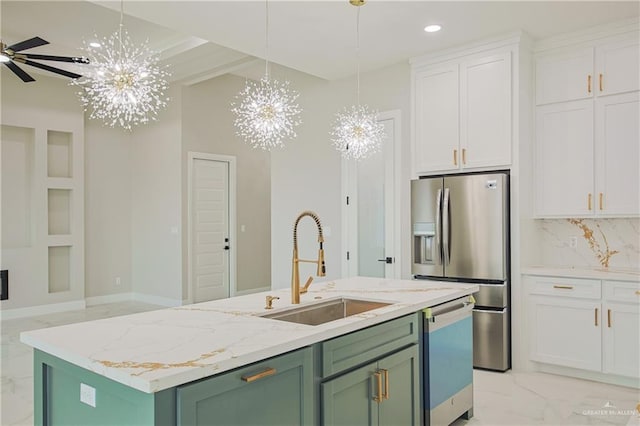 kitchen with a sink, green cabinets, marble finish floor, dishwasher, and stainless steel fridge