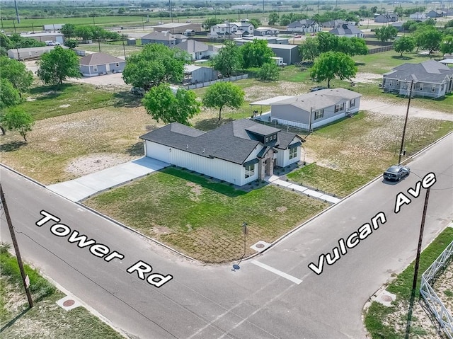 birds eye view of property with a residential view