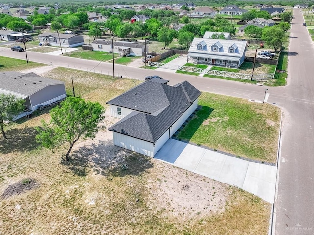 birds eye view of property with a residential view