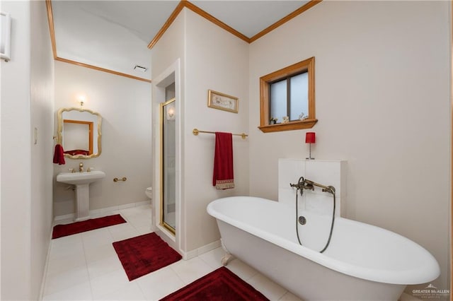 full bathroom featuring plus walk in shower, tile patterned floors, sink, crown molding, and toilet